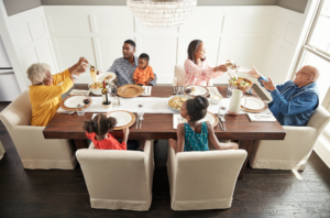 Family enjoying meal | We'll Floor You